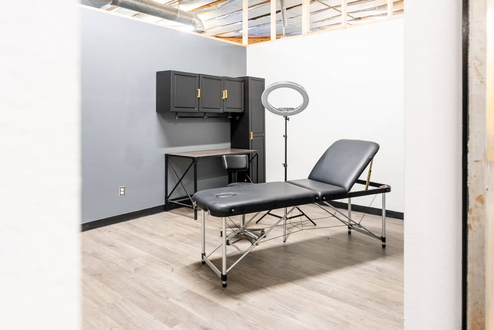 A suite with cabinets, desk and ring light